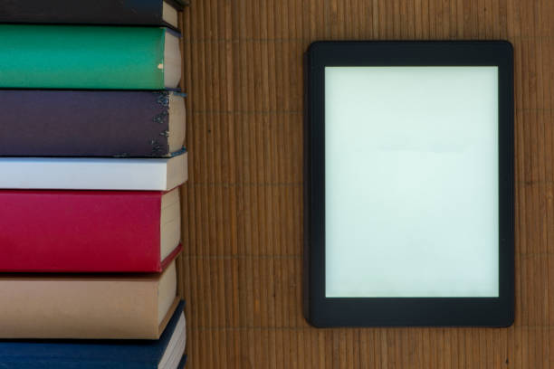istock An ebook with the white screen surrounded by books 1008866718