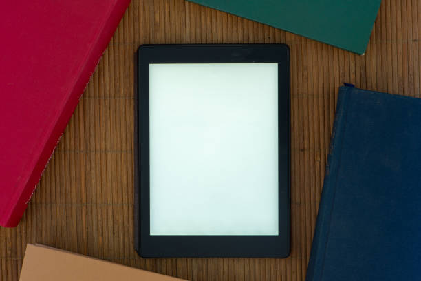 istock An ebook with the white screen surrounded by books 1008866724
