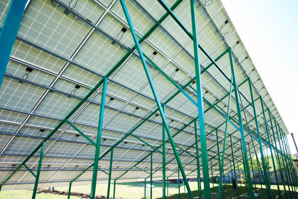 istock Green metallic carcass maintaining solar batteries. 1008870066