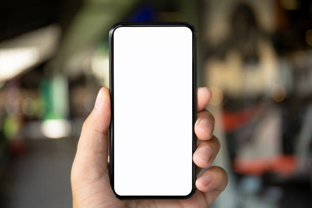istock man hand holding phone with isolated screen on background city 1008876434