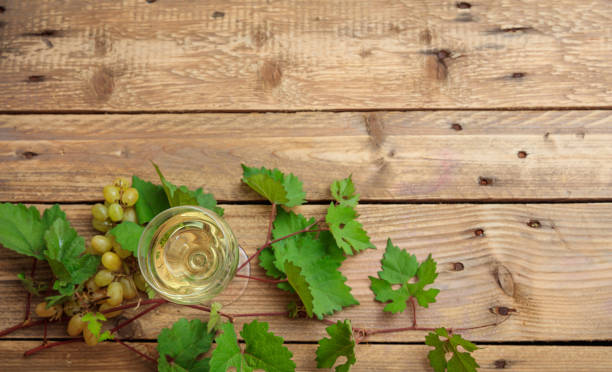 istock White wine glass and fresh grapes 1008879996