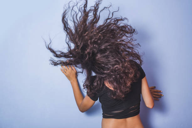 istock Young woman with curly hair 1008880248