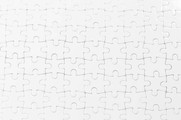 istock Blue background made from white puzzle pieces and place for your content 1008881658
