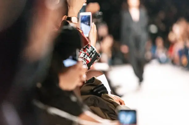 Using smart phone to film fashion show