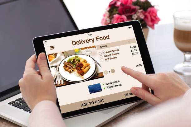 istock woman hands holding tablet computer with app delivery food screen 1008888370