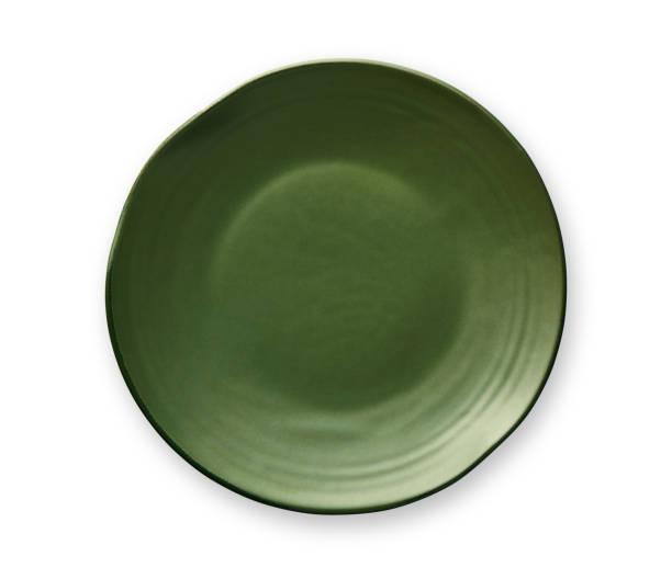 istock Empty green plate with wavy edge, Frilled plate in wavy pattern, View from above isolated on white background with clipping path 1008898242