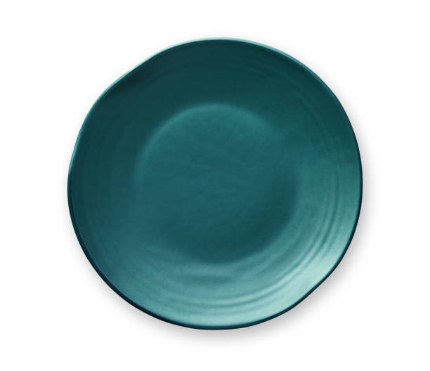 istock Empty blue plate with wavy edge, Frilled plate in wavy pattern, View from above isolated on white background with clipping path 1008898296