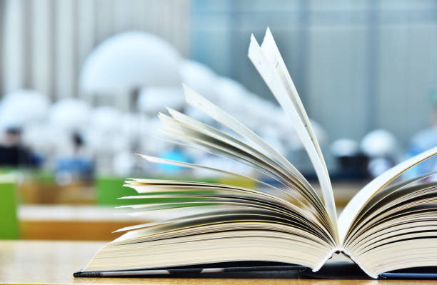 istock Books lying on the table in the public library 1008905508