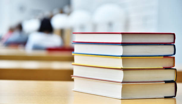 istock Books lying on the table in the public library 1008905526
