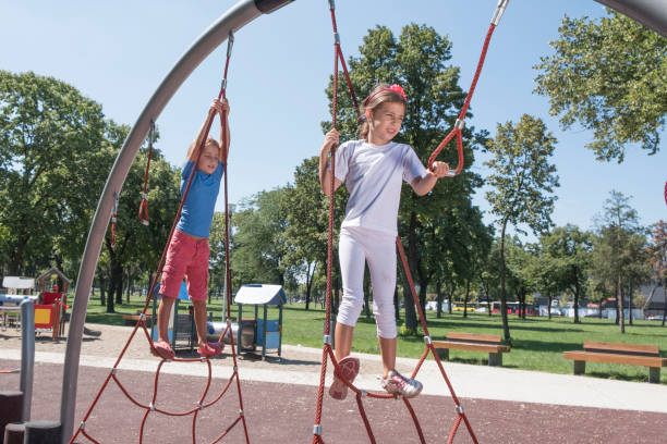 istock Elementary children play at school recess or park on playground 1008905536