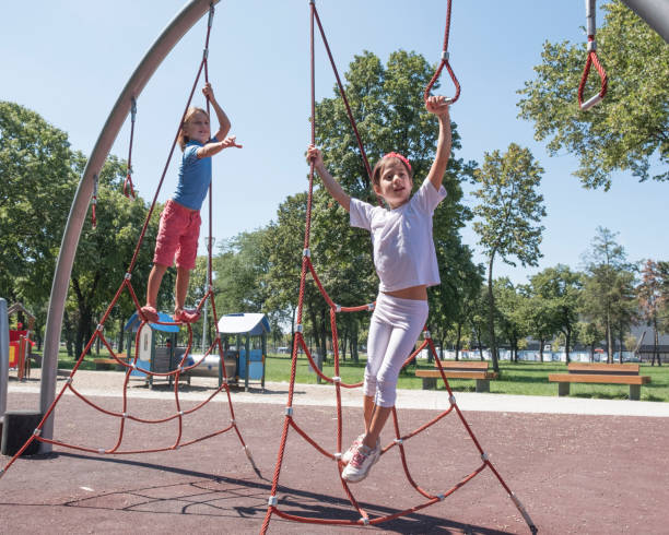 istock Elementary children play at school recess or park on playground 1008906216