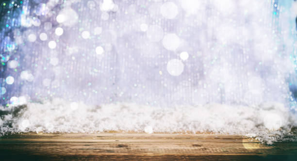 istock Wooden surface Christmas snowy background 1008906468