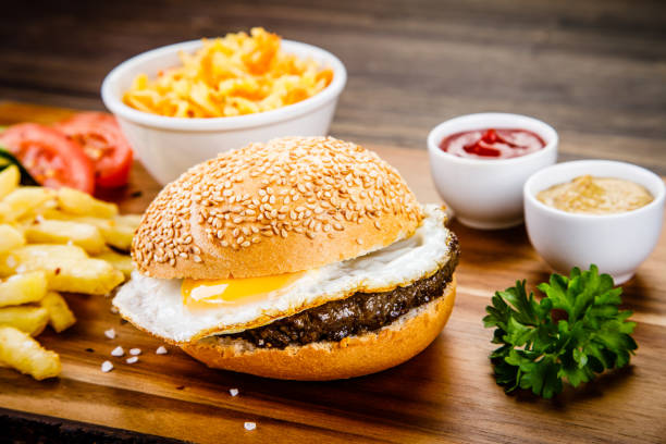 istock Big burger, French fries and vegetables 1008916580