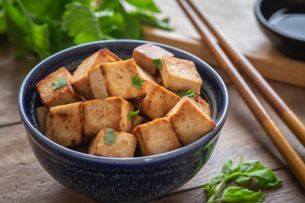 istock Fried tofu in bowl, Vegetarian food 1008918076