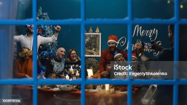Big Family Taking Photo Together At Christmas Stock Photo - Download Image Now - Christmas, Memories, Dinner