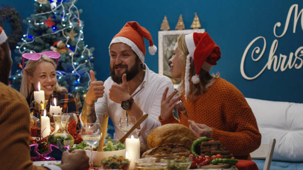 istock Diverse friends dining together at Christmas 1008922280
