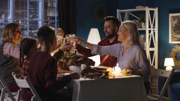 istock Family having Thanksgiving dinner together 1008922502
