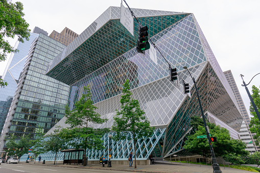 Seattle, Washington - July 1, 2018 : Exterior view of the Seattle Central Library, a landmark glass building designed by architects Rem Koolhaas and Joshua Prince-Ramus, located in downtown Seattle.