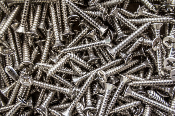 istock Closeup of steel screws background 1008926836
