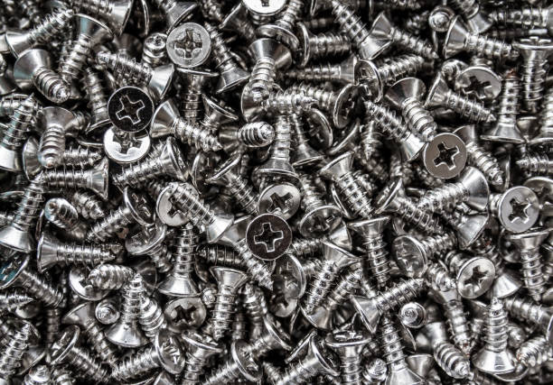 istock Closeup of steel screws background 1008926878
