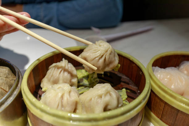 istock Chinese dumpling in a bamboo steamer box 1008930798