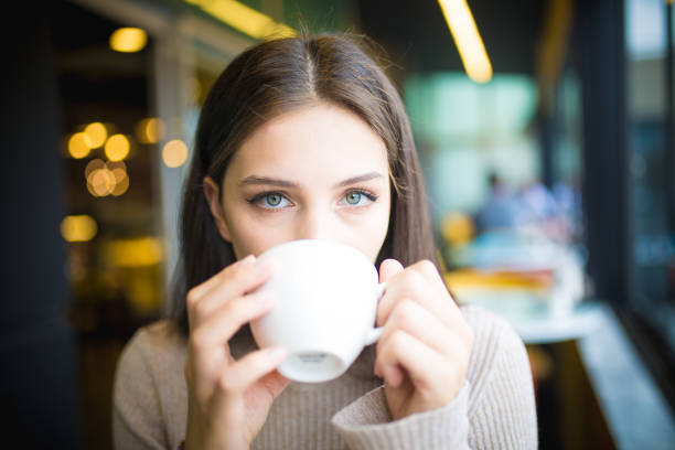 istock women who is enjoy in cafe 1008939910