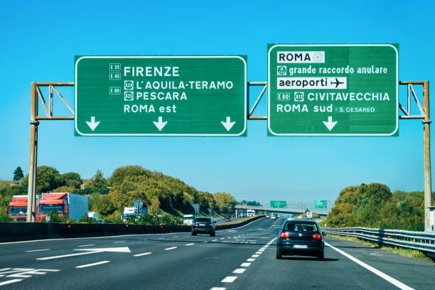 Cars and green traffic signs to Firenze and Roma road Rome, Italy - October 4, 2017: Cars and green traffic signs to Firenze and Roma in the road in Italy florence italy airport stock pictures, royalty-free photos & images