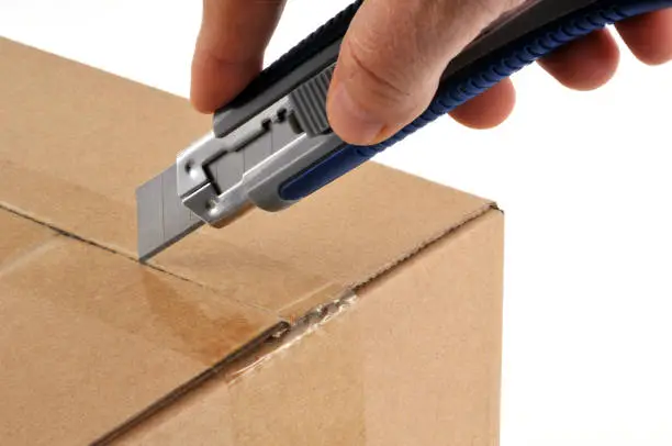 Photo of Open a box with a cutter