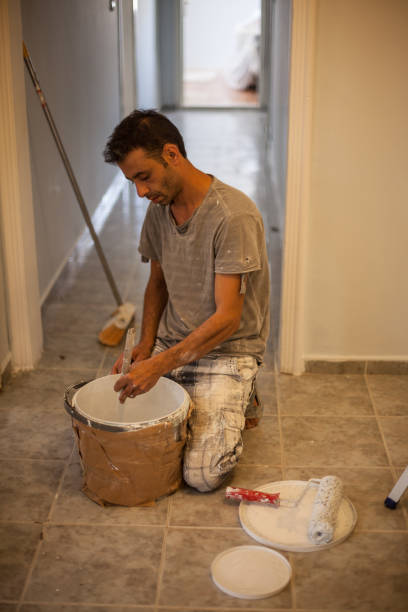 istock Portrait Of House Painter Working Indoor 1008953300
