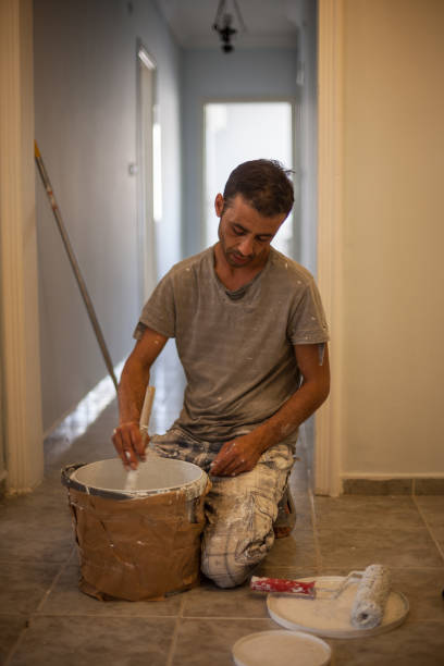 istock Portrait Of House Painter Working Indoor 1008957712