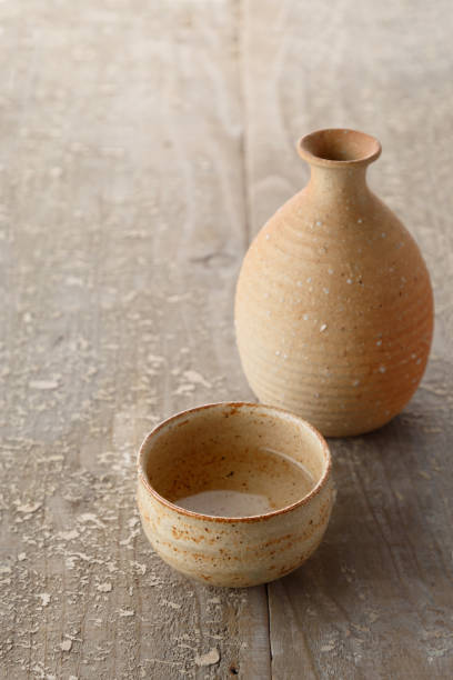 istock Old wooden table and sake 1008957812