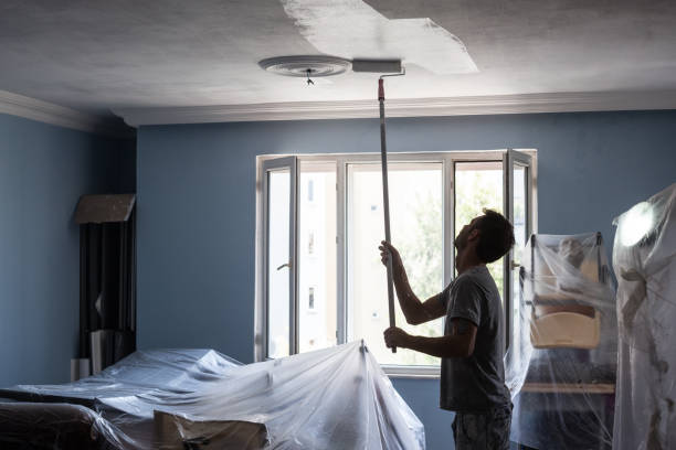 istock Portrait Of House Painter Working Indoor 1008958032