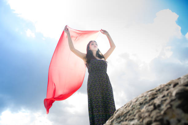 istock woman meditating in nature 1008973418