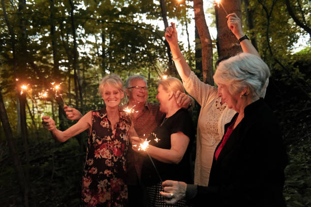 istock Good Old Friends lighting sparklers 1008973864