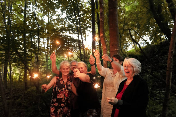 istock Good Old Friends lighting sparklers 1008973872