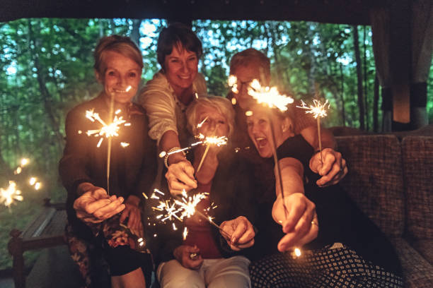 istock Good Old Friends lighting sparklers 1008973908