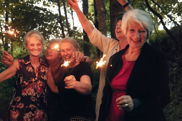 istock Good Old Friends lighting sparklers 1008973912