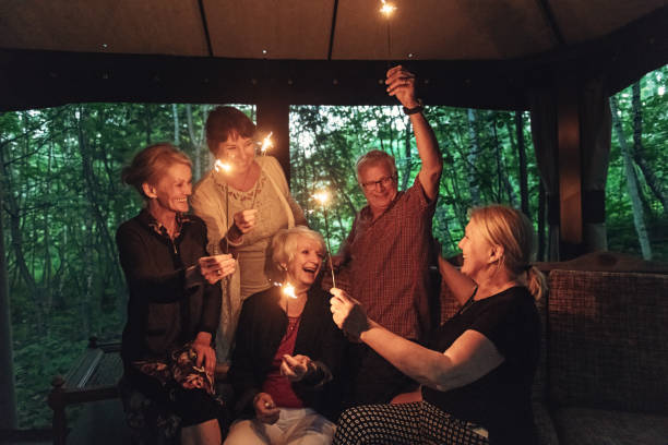 istock Good Old Friends lighting sparklers 1008973954