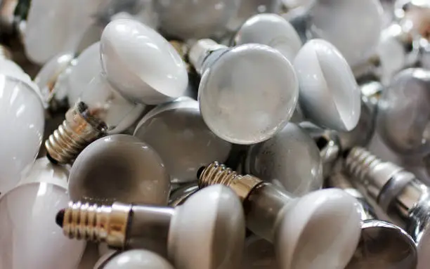 Photo of Disposal of used energy saving lamps, old spent bulbs.