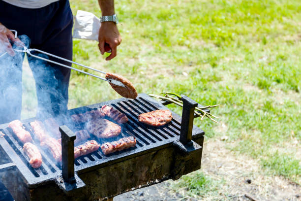 istock Turning delicious juicy minced meat on barbecue 1008978896