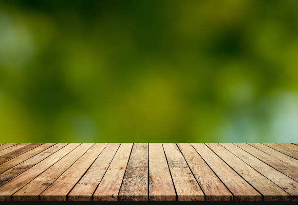 istock Wood plank with abstract green blurred background for product display
Keyword here 1008978960