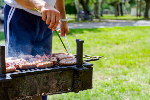 istock Turning delicious juicy minced meat on barbecue 1008979168