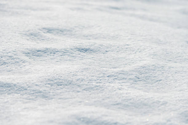 nahaufnahme eines weißen schnee hintergrund - snow texture stock-fotos und bilder