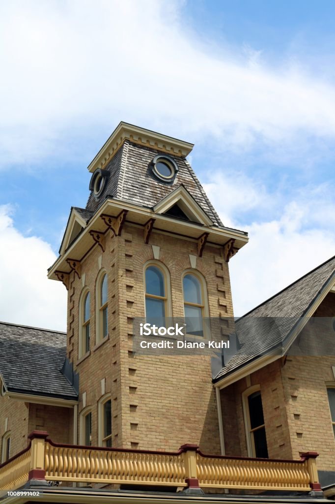 Former Governor's House in downtown Kitchener, Ontario, Canada Built in 1878 it is one of the last existing houses of this time in the area. Its elegance and four-story tower reflected the Governor's respected position. Build in mid-Victorian Italian Villa style with a Mansard roof. Waterloo - Ontario Stock Photo