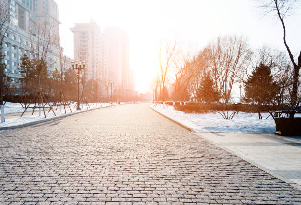 The brick road is covering with snow The brick road is covering with snow. winter city stock pictures, royalty-free photos & images