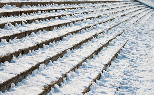 istock Stone stairs covering with snow 1008994178