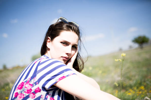istock female model photography between flowers 1009016700