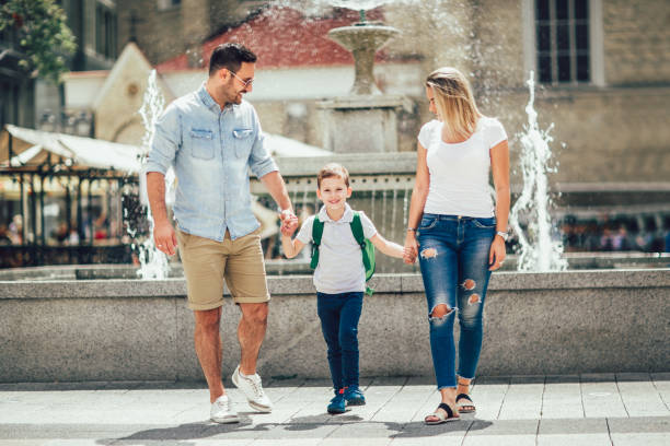 istock Young parents taking their little child to school 1009031804