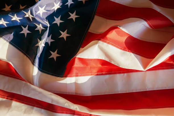 istock American flag waving background 1009034170