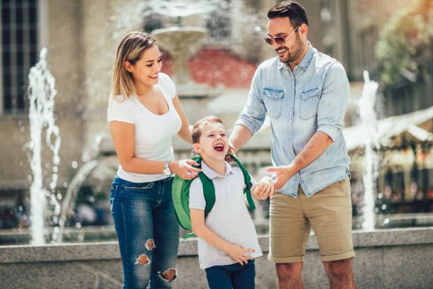 istock Young parents taking their little child to school 1009036214